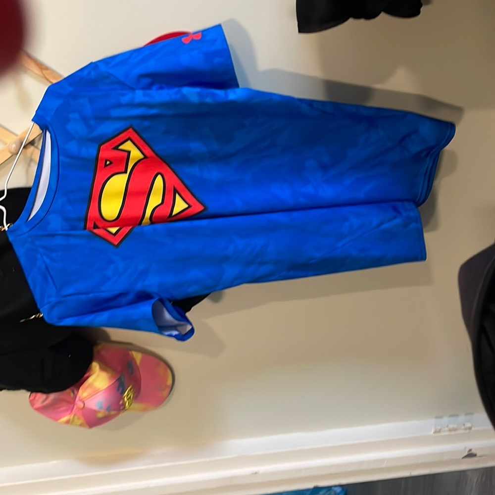 Blue superman shirt 2xl mainly used for workout clothes. Under armour brand
